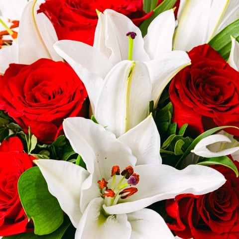Love note: Red roses and white lilies highlight